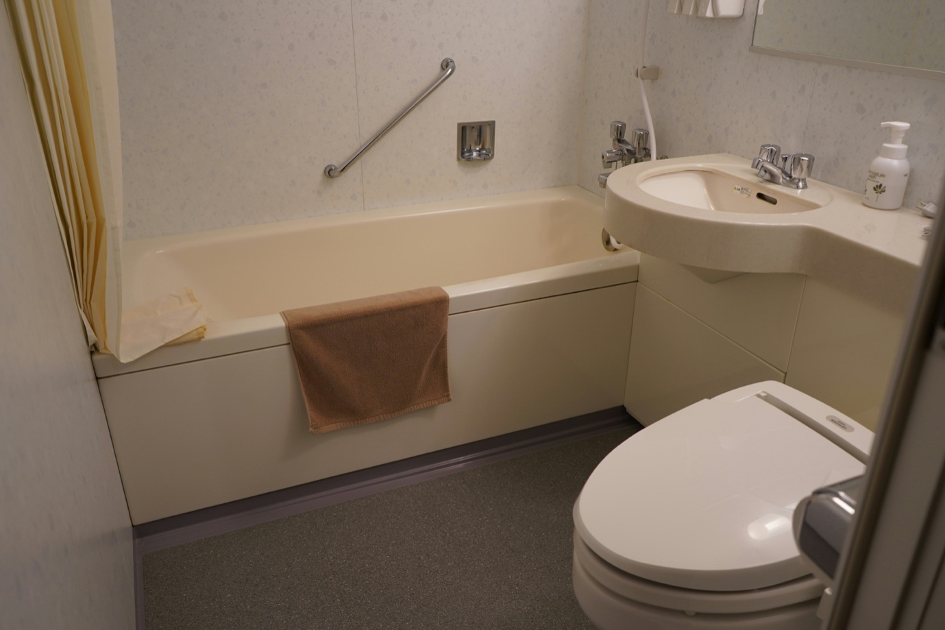 A plumber installing a basement bathroom in a Boston home